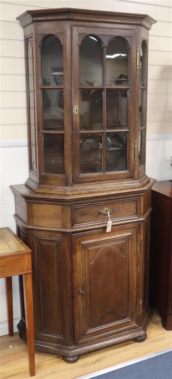 An 18th century Flemish oak two part cabinet H.204cm